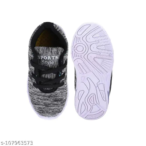 Black and white kids' sports shoes with a LED light on top