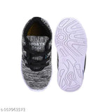Black and white kids' sports shoes with a LED light on top