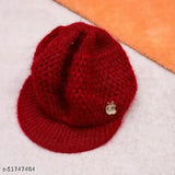 Red knitted beanie with a small emblem on it