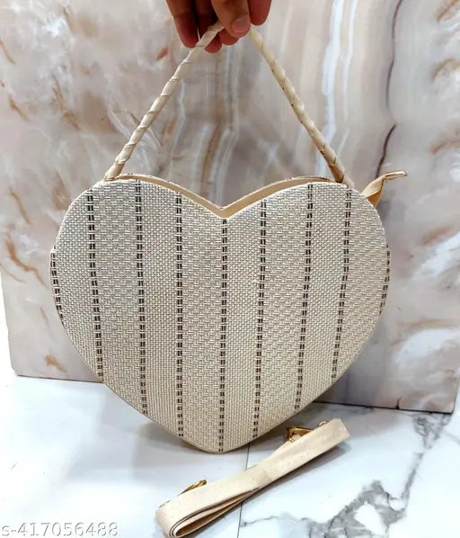 Heart-shaped sling bag for women, soft jute fabric with shoulder belt and knot design, handheld handle