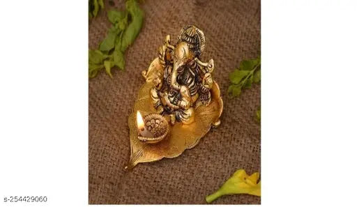 Golden Metal Handcrafted Lord Ganesha Idol with Diya on Leaf, high-grade brass, unique Indian artisan craft