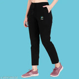 Trendy women's track pants, black with white logo on waistband