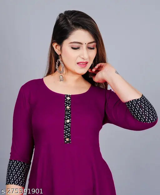 Purple rayon, round pleated flared kurti with three-quarter sleeves for women. Machine washable, hand wash recommended. One piece included. Size declaration: choose two inches larger than body measurement. Color may vary due to lighting sources or monitor settings. Made in India