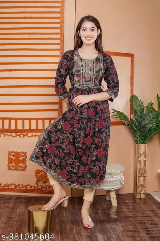 Black gold rayon Naira cut kurti, printed combo three-quarter sleeve fashion for women, close-up view on hanger