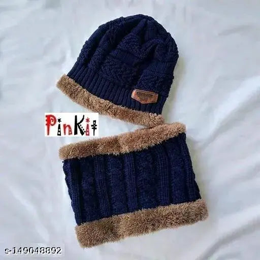 Navy blue knitted beanie cap with faux fur trim and pompom, winter accessory for men or women