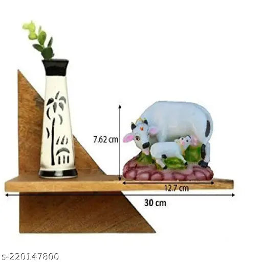 Decorative white ceramic cow idol with calf, 4 inches tall