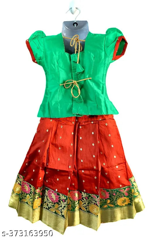 Designer silk lehenga-choli and pattu pavadai set for kids, embellished with zari stitch, suitable for festivals or parties