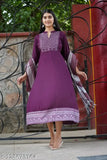 Rayon Anarkali gown with printed net, three-quarter sleeves and embroidered dupatta. Indian fashion for women in sizes M-6XL