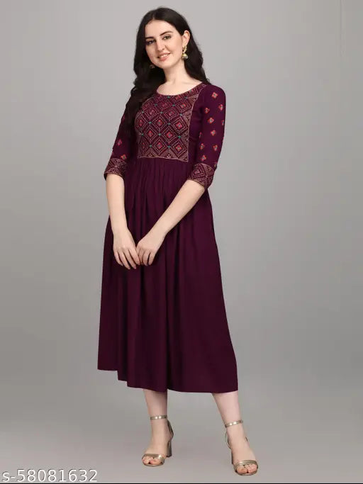 Maroon embroidered long kurta with short sleeves, standing against a light grey background