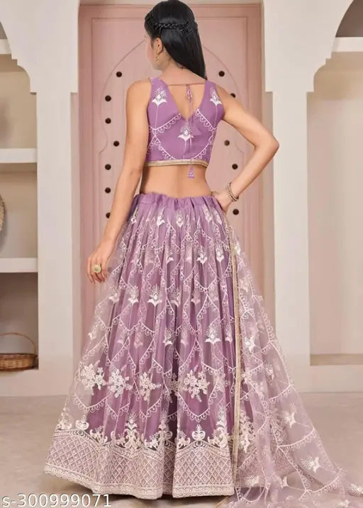 Embroidered net lehenga choli and dupatta set for girls party wear, 13-14 years old Indian embroidery on display
