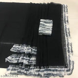 A black and white printed georgette saree with a blouse piece