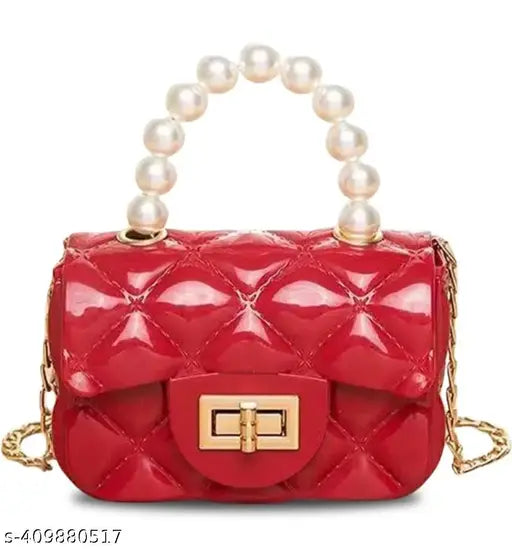 Red quilted small shoulder bag with pearl accents and gold clasp
