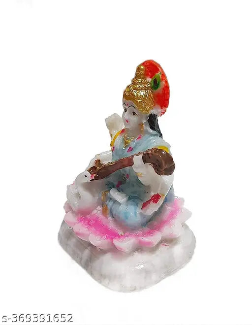 Resin Saraswati statue, marble figurine of Saraswati ji for home temple decor. Dimensions: 10cm L x 11cm H x 10cm B. Made in India