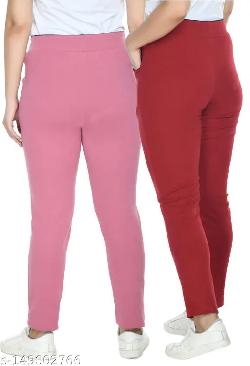 Pink & Red cotton blend solid stretchable jeggings pack of 2 for women, perfect for everyday use with stylish tops. Mid-waist design, wide elasticated waistband, and pockets. Available sizes: 26 (waist 26in, length 37in), 28, 30, 32, 34, 36, 38 (India)