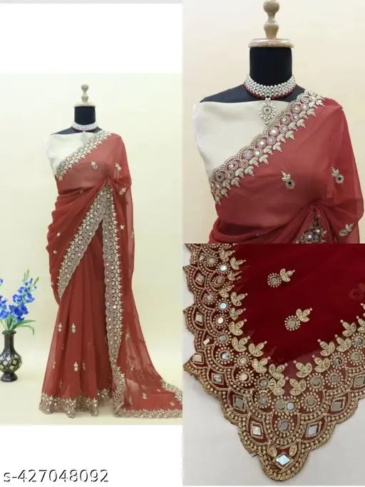 Red cutwork mirror saree with intricate designs and a fitted bodice