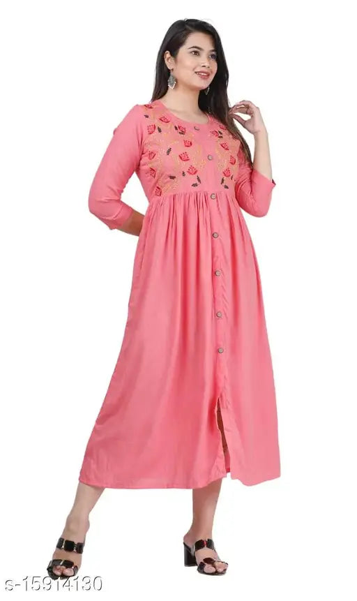 Peach embroidered Rayon kurti, trendy flared style with three-quarter sleeves, Indian designer fashion on model