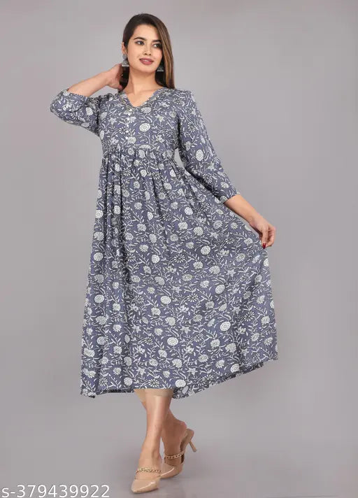 Rayon Women's printed pom-pom anarkali with three-quarter sleeves, featuring a casual and festive design. Available in multiple sizes: S-5XL (India)