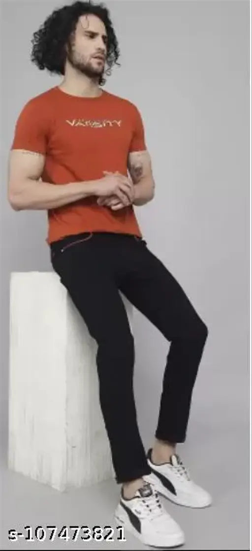 Solid black denim men's jeans with red pocket lining by DAKWINS. Stretchable fabric, comfortable fit, ideal for casual or special occasions. Made in India." (125 characters)