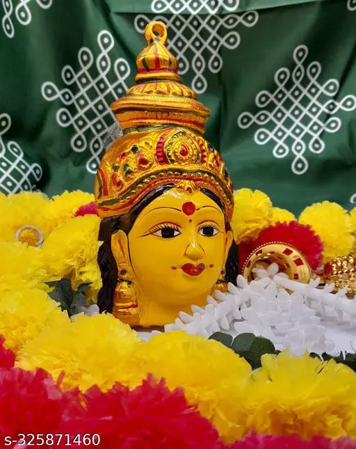 Yellow aluminum Varamahalakshmi Yantra idol, intricately adorned with jewels by Shivoo Fashion