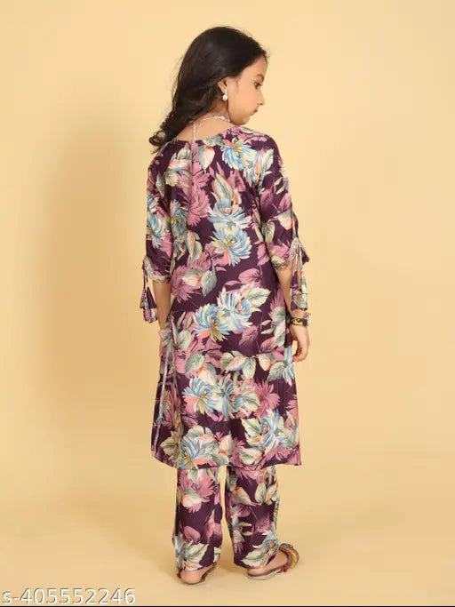New Designer Printed Kora Muslin Kurta Sharara Set with Dupatta for Kids in A-line style, featuring vibrant prints and long sleeves. Perfect for festive occasions