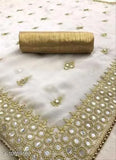 Gold silk saree with intricate mirror work and silver border