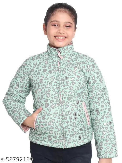 The image shows a young girl wearing a fashionable, light blue coat with a distinct paisley print design. The coat features a zipper closure and appears to have long sleeves. The material of the jacket is likely a cotton or cotton blend fabric for added comfort and durability