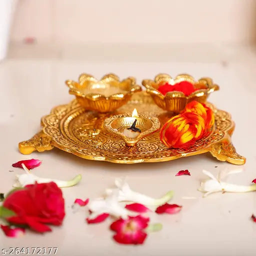 Metal small Puja thali set with 3 diya, for home, temple, office decoration and gifting. Swastik-engraved, floral design, antique gold finish, size: 18x18x4 cm. Made in India