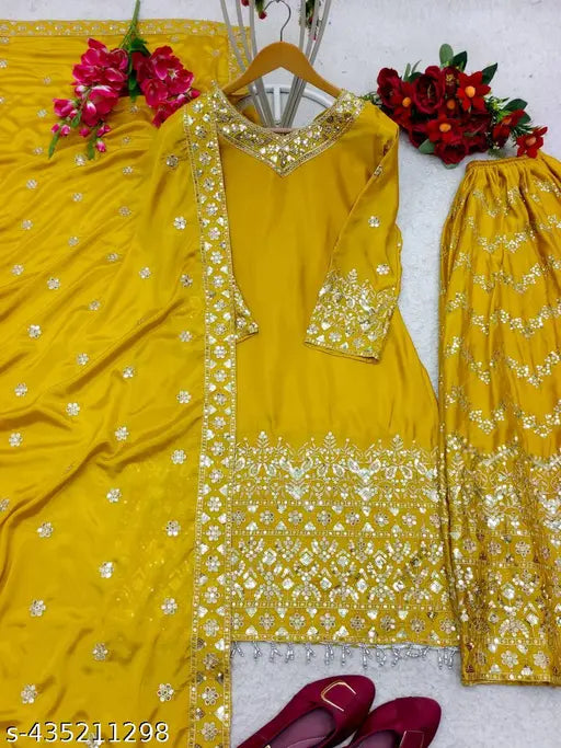 Designer embroidered yellow sharara with traditional outfit accessories
