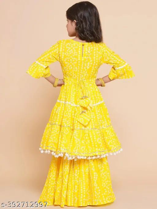 Girls yellow printed Sarara Set: Rayon anarkali palazzos with three-quarter sleeves, Indian girls clothing set on display