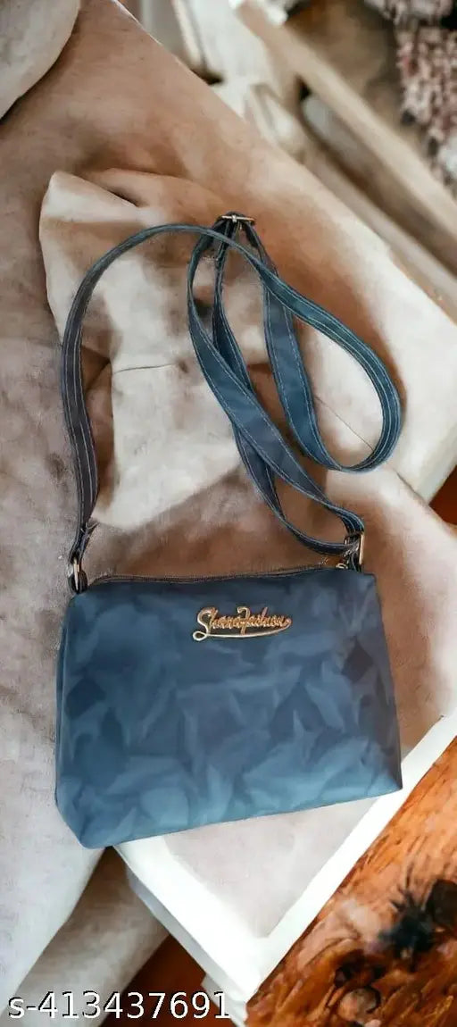 Blue, patterned sling bag with a shoulder strap