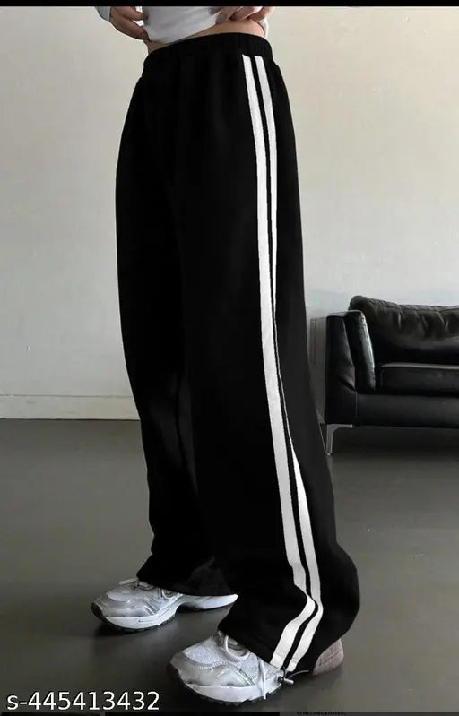 Black and white striped Adidas brand pants