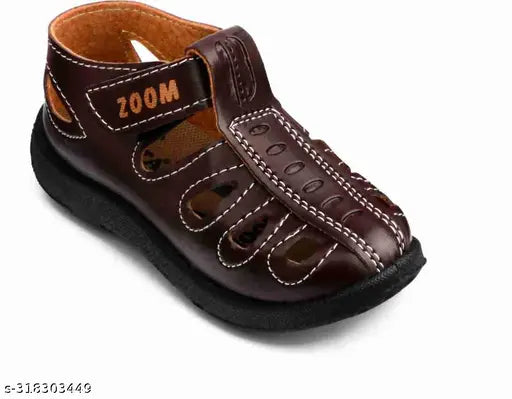 The image is of a pair of Velcro strap sandals in brown color