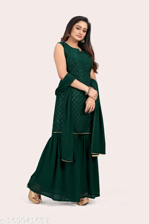 A woman wearing a green georgette sleveless kurta with a matching sharara set