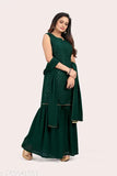 A woman wearing a green georgette sleveless kurta with a matching sharara set