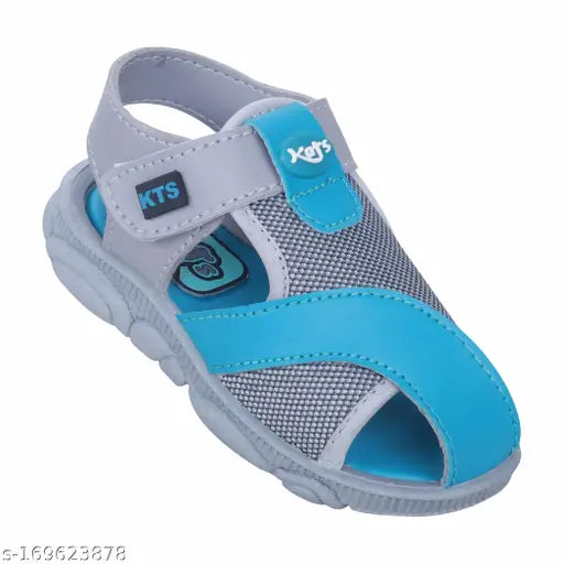 Black fabric slippers with blue trim and X on the strap, for boys