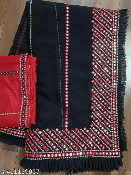 A traditional South Asian sari in red and black hues with fringe detailing