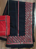 A traditional South Asian sari in red and black hues with fringe detailing