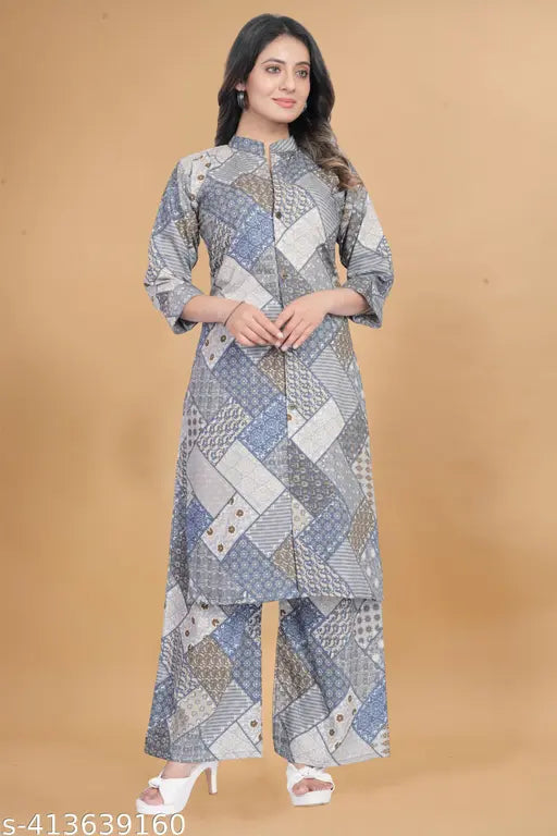 Printed cotton and polycotton two-piece kurta and palazzo set for women, featuring loose fit and three-quarter sleeves. Available in sizes S to XXXL. Indian-made