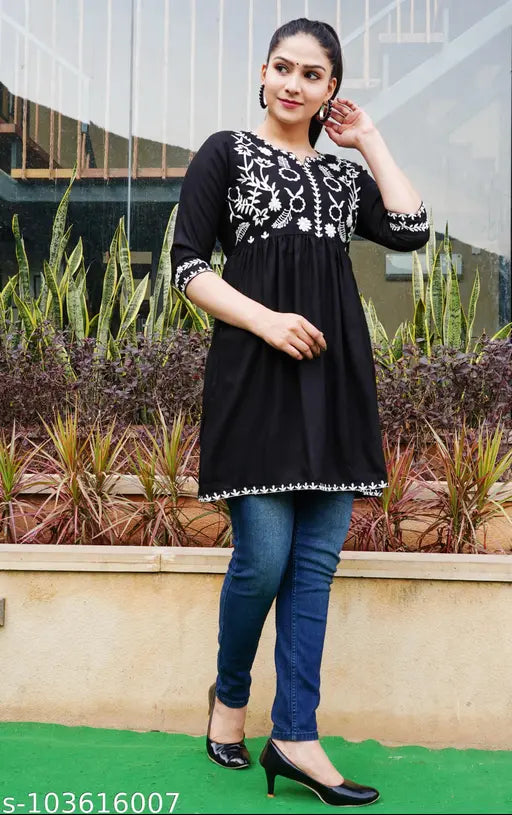 Black short kurti with fitted waist, flared skirt, front pockets