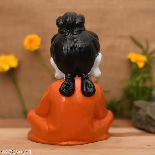 Orange poly resin Buddha statue: 12cm high and 12cm wide, The Rich Pari's Little Baby Monk showpiece