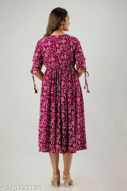 Printed rayon long anarkali kurta with 3/4 sleeves, tassels, and hand embroidery. Women's ethnic wear in cotton fabric, color retains after wash