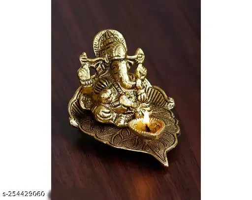 Golden Metal Lord Ganesha Idol with Diya on Leaf - Handcrafted, unique, brass home decor for pooja or festive occasions