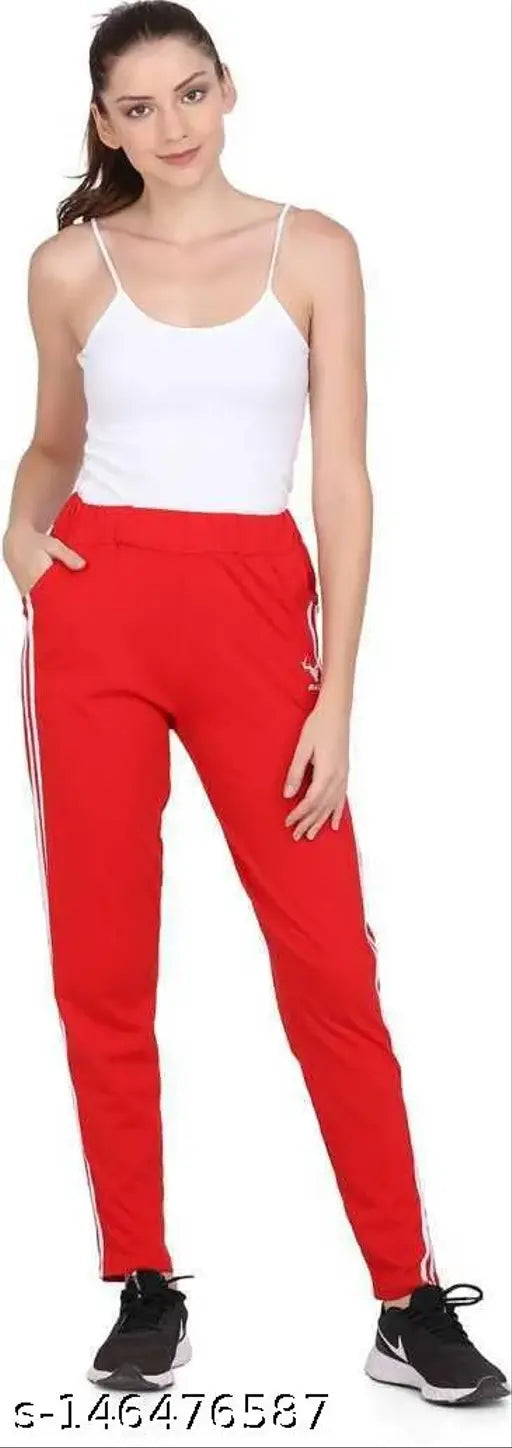 The image displays a woman in red leggings and white top, striking a pose