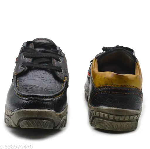 Three boys' casual sneakers with black laces and soles, displaying a variety of colors and sizes
