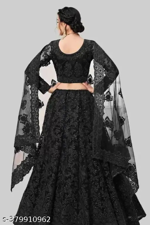 Embroidered net lehenga set, free size. Indian wedding wear with net top and bottomwear featuring intricate embroidery details