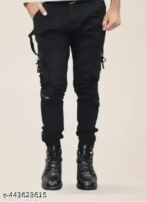 Black stretch denim skinny jeans with ripped knee detail, zip fly closure