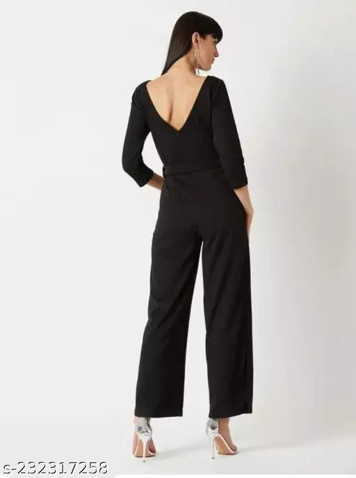 Black polyester jumpsuit with belt, solid design, three-quarter sleeves, imported from India. Soft, stretchable, and suitable for all weather types