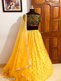 Yellow embroidered net lLehengas with dupatta, traditional Indian bridalwear for haldi and weddings