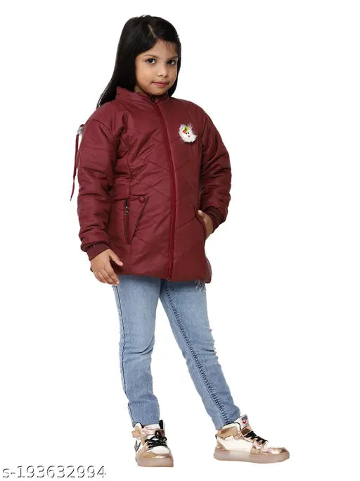 A young girl wearing a red padded jacket with a hood, posing against a white background