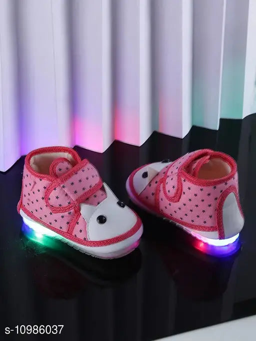 Pink and white sneakers with colorful soles, glowing neon light accents